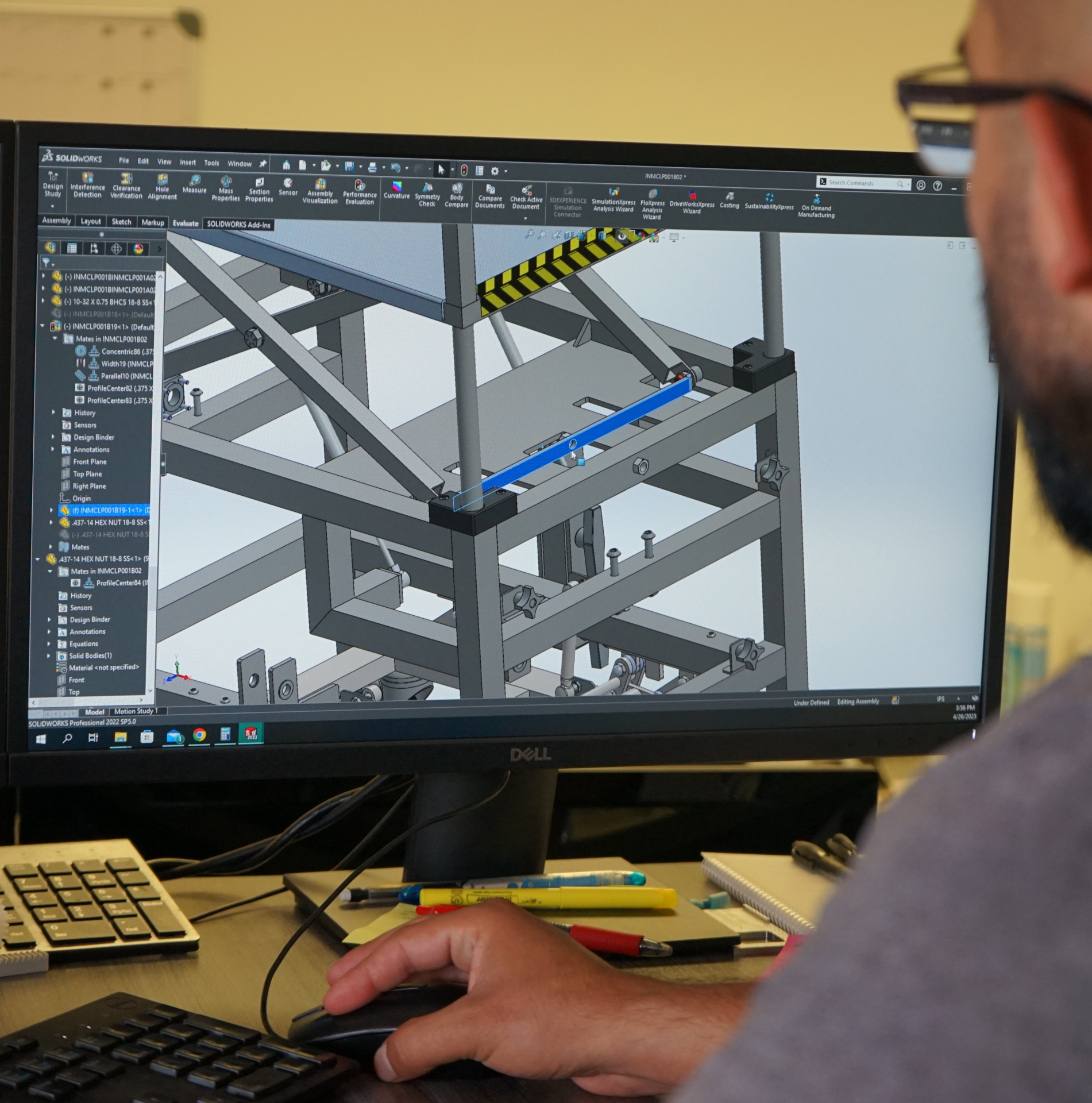 Picture of a Design Engineer working in SolidWorks at his desk.  Click on this picture to show how Pro-Fab can help you with design services.  